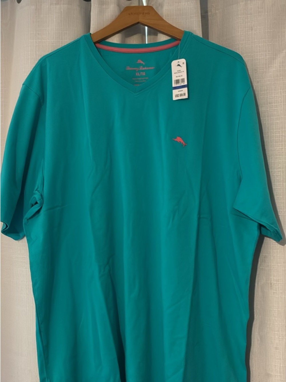 Tommy Bahama Teal V‑Neck Short Sleeve Shirt with Pink Dolphin Logo Bali skyline